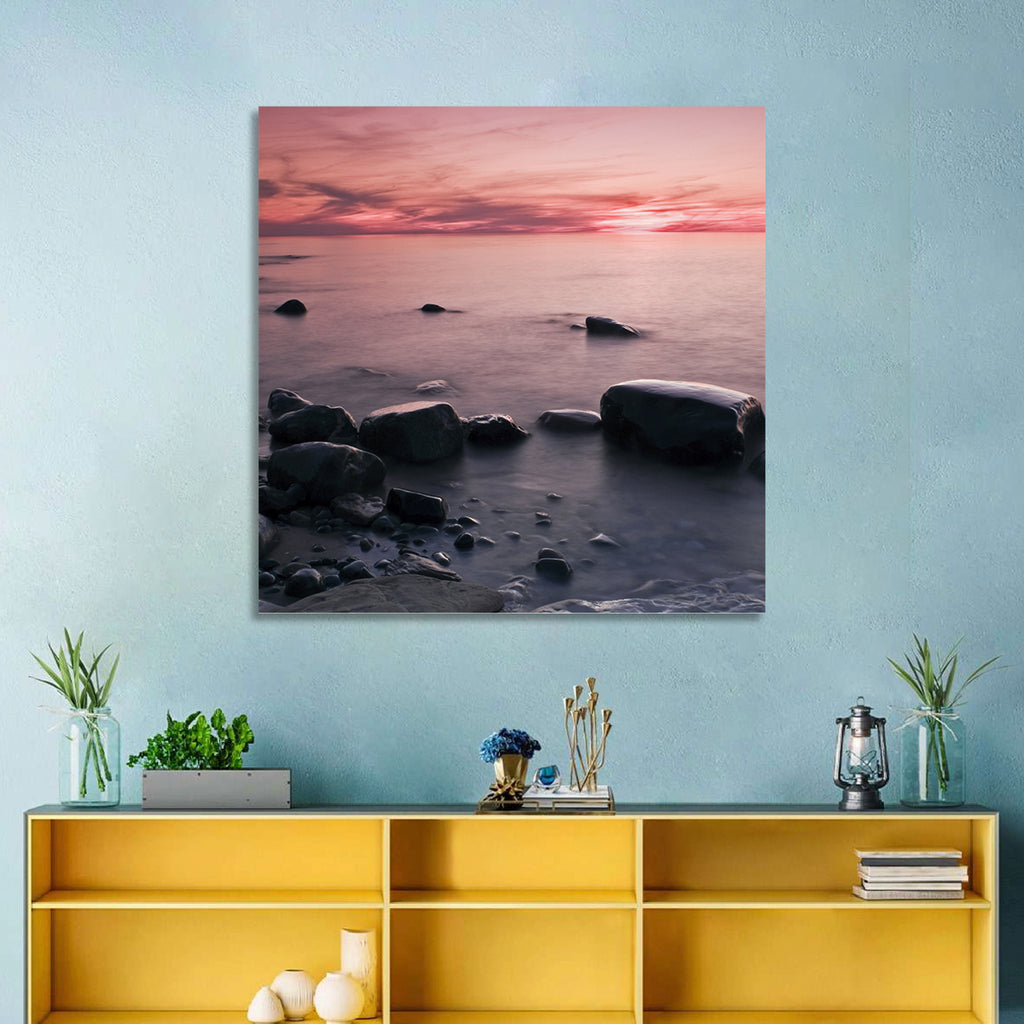 Pink Dusk Lakeshore with Silhouetted Rocks Wall Art