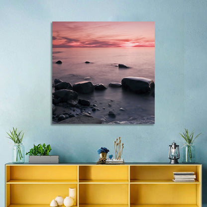Pink Dusk Lakeshore with Silhouetted Rocks Wall Art