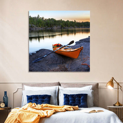 Orange Kayak on Rocky Shore Wall Art