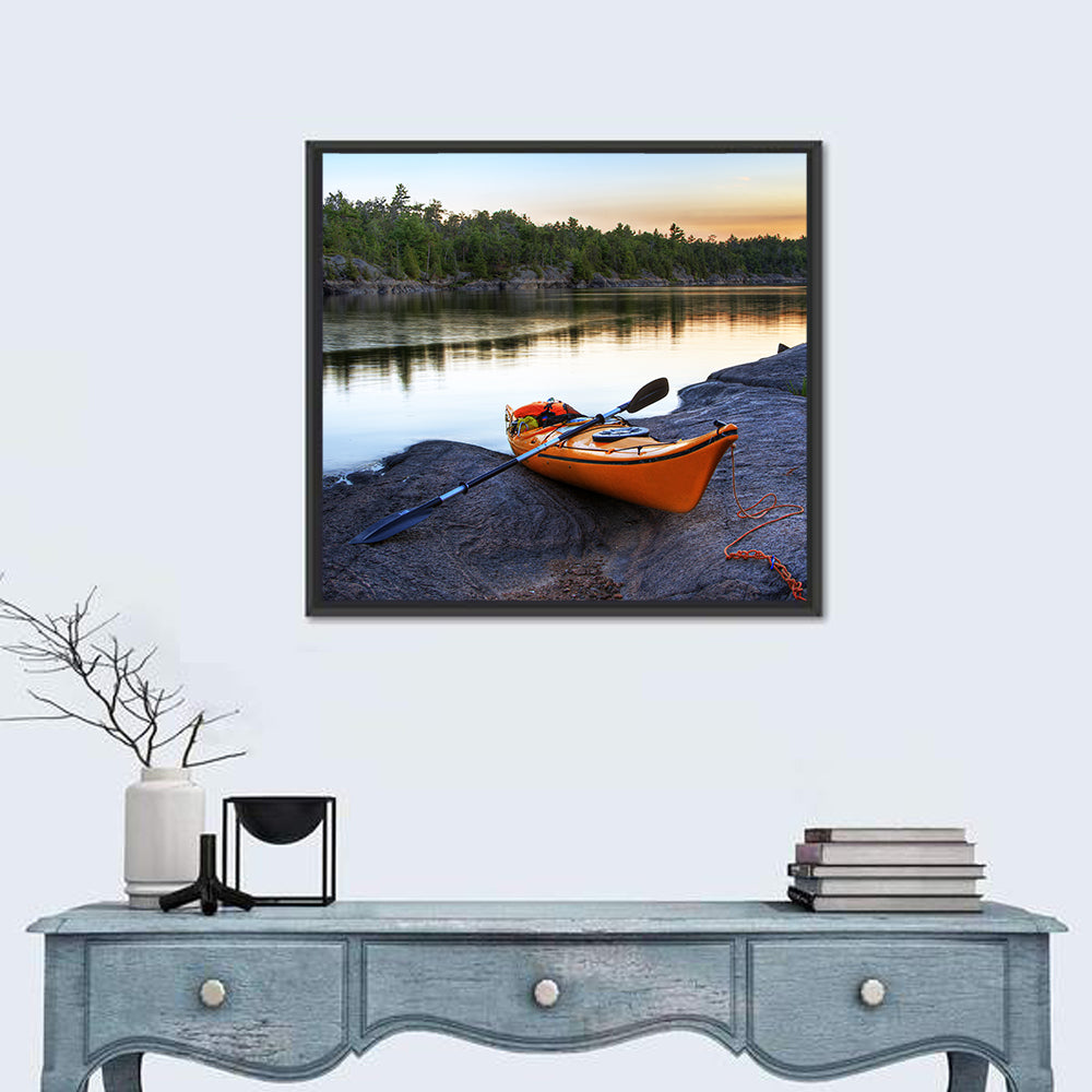 Orange Kayak on Rocky Shore Wall Art