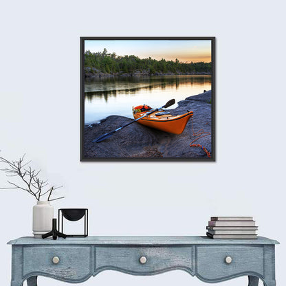 Orange Kayak on Rocky Shore Wall Art