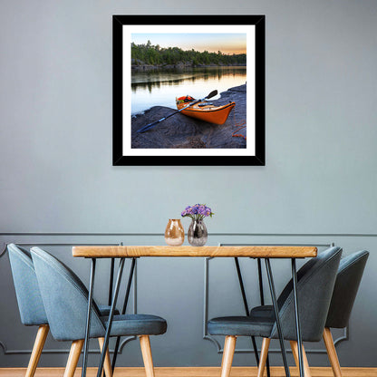 Orange Kayak on Rocky Shore Wall Art