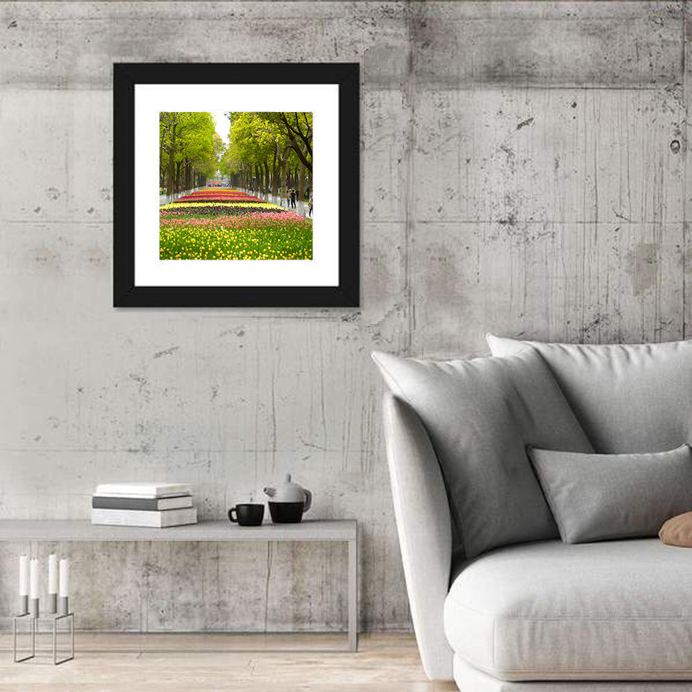 Tree-lined Tulip Garden Path Wall Art in a room, square