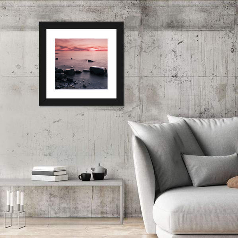 Pink Dusk Lakeshore with Silhouetted Rocks Wall Art