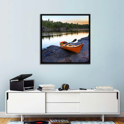 Orange Kayak on Rocky Shore Wall Art