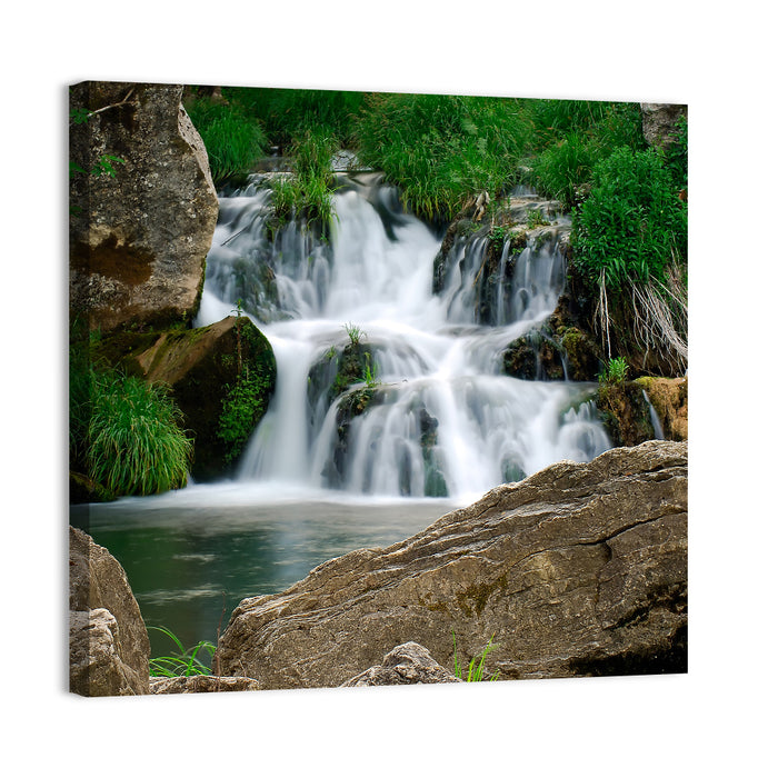 Moss Covered Rocky Waterfall Wall Art as a canvas print