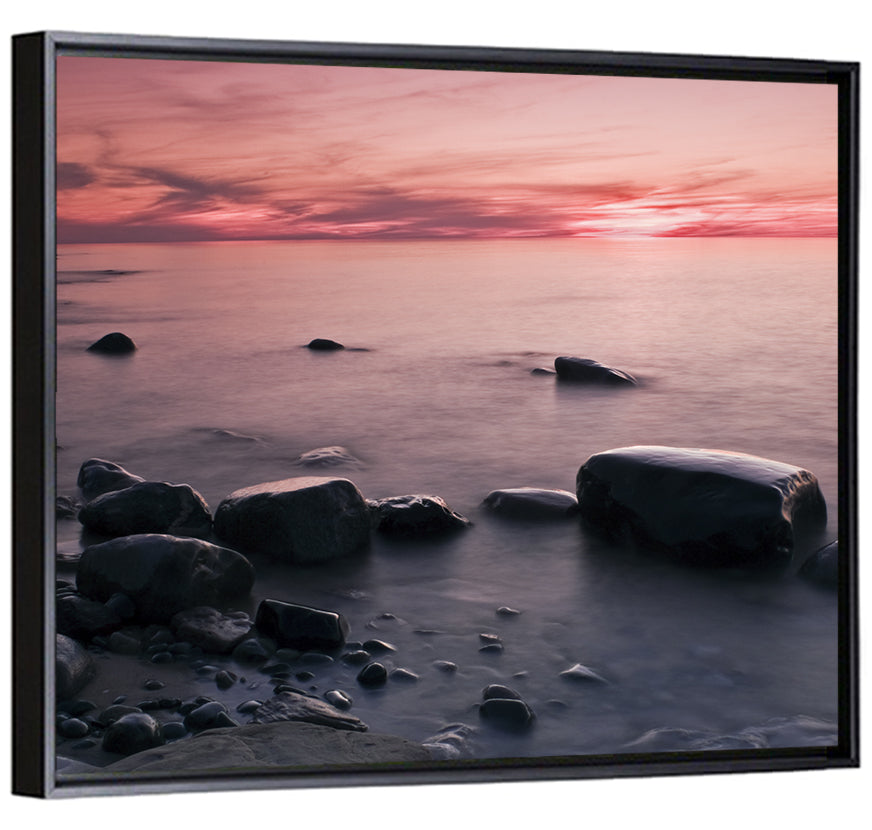 Pink Dusk Lakeshore with Silhouetted Rocks Wall Art