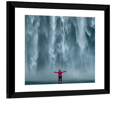 Skogafoss Waterfall with Figure in Pink Wall Art