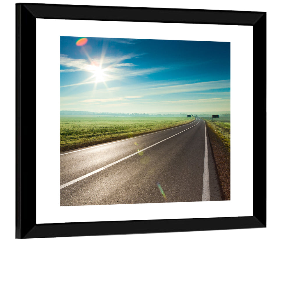 Sunlit Road Through Green Field Wall Art