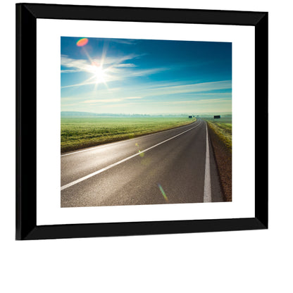 Sunlit Road Through Green Field Wall Art