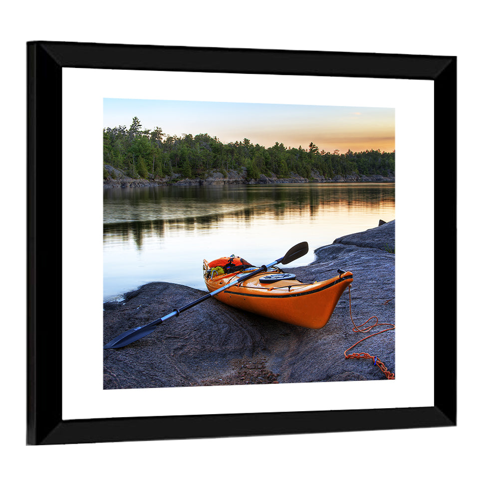 Orange Kayak on Rocky Shore Wall Art