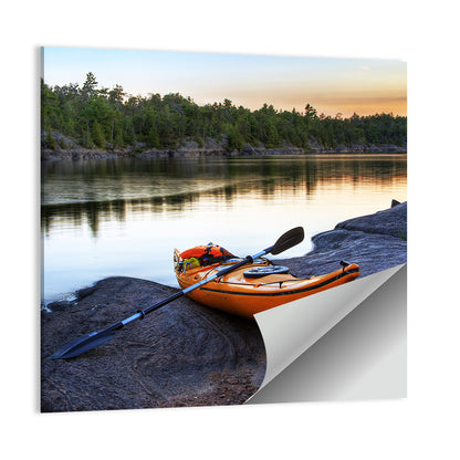Orange Kayak on Rocky Shore Wall Art