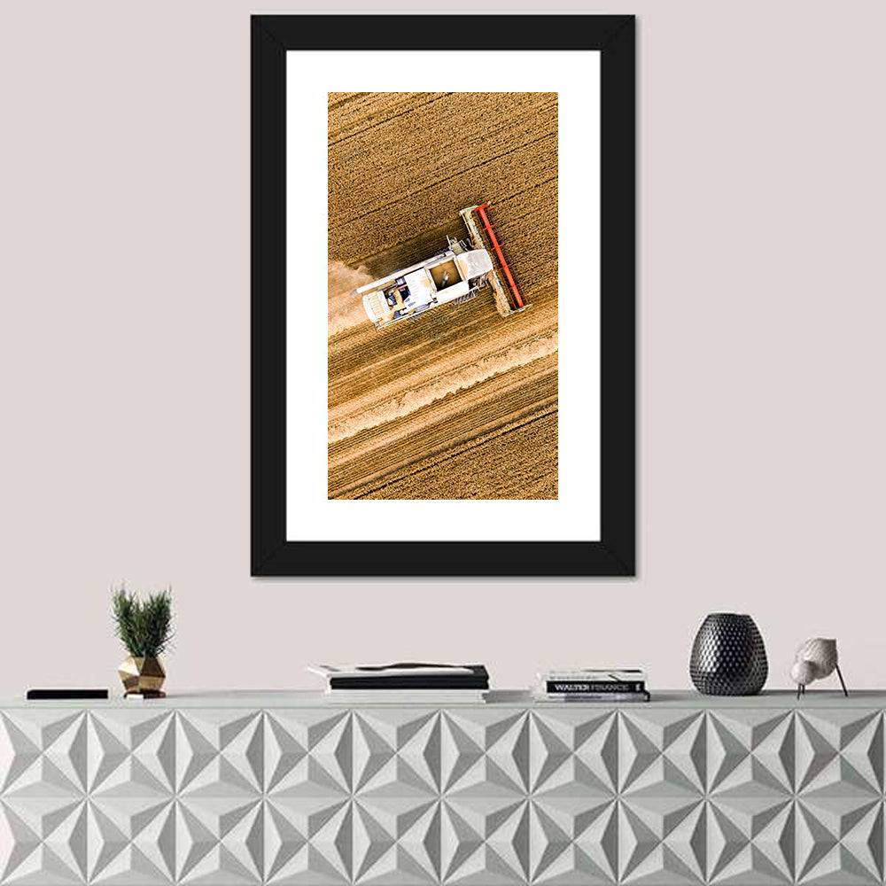 Aerial Combine Over Wheat Field Wall Art in a room, portrait